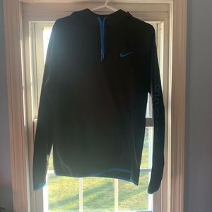 Selling a size Small Nike “just do it”sweater. Black with bits of blue.